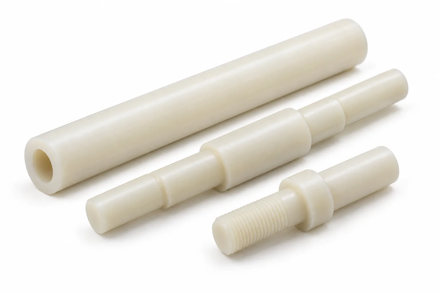 Natural ivory nylon shafts with stepped journals, external threads and a hollow bore