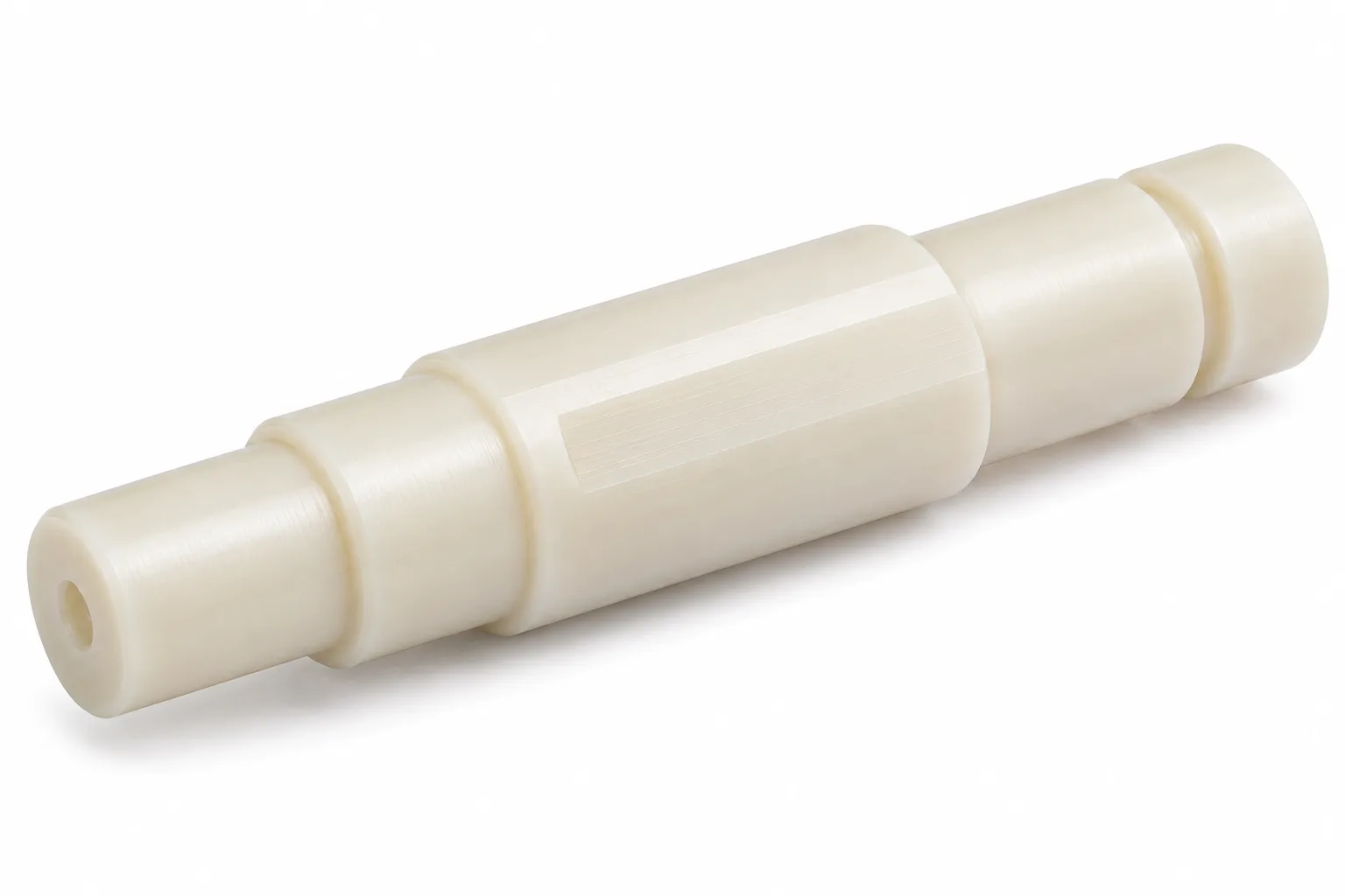 Custom Profile Nylon Shafts in natural ivory machined nylon on white