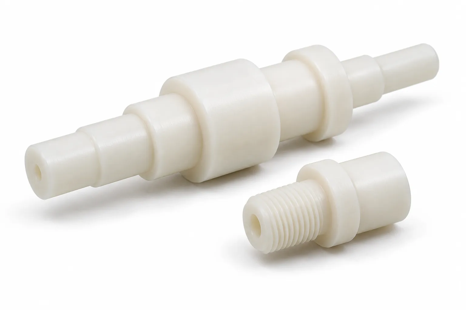 Custom natural ivory nylon shafts with stepped and threaded features