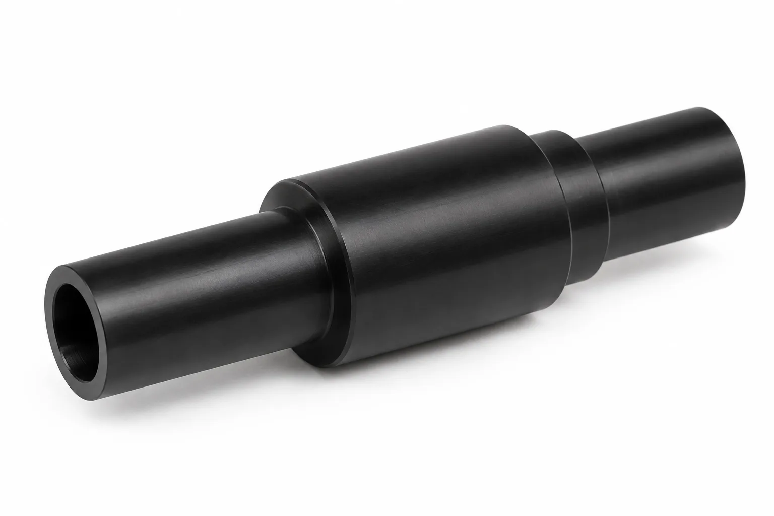 Hollow POM Shafts showing opaque acetal plastic and finished machining features on white