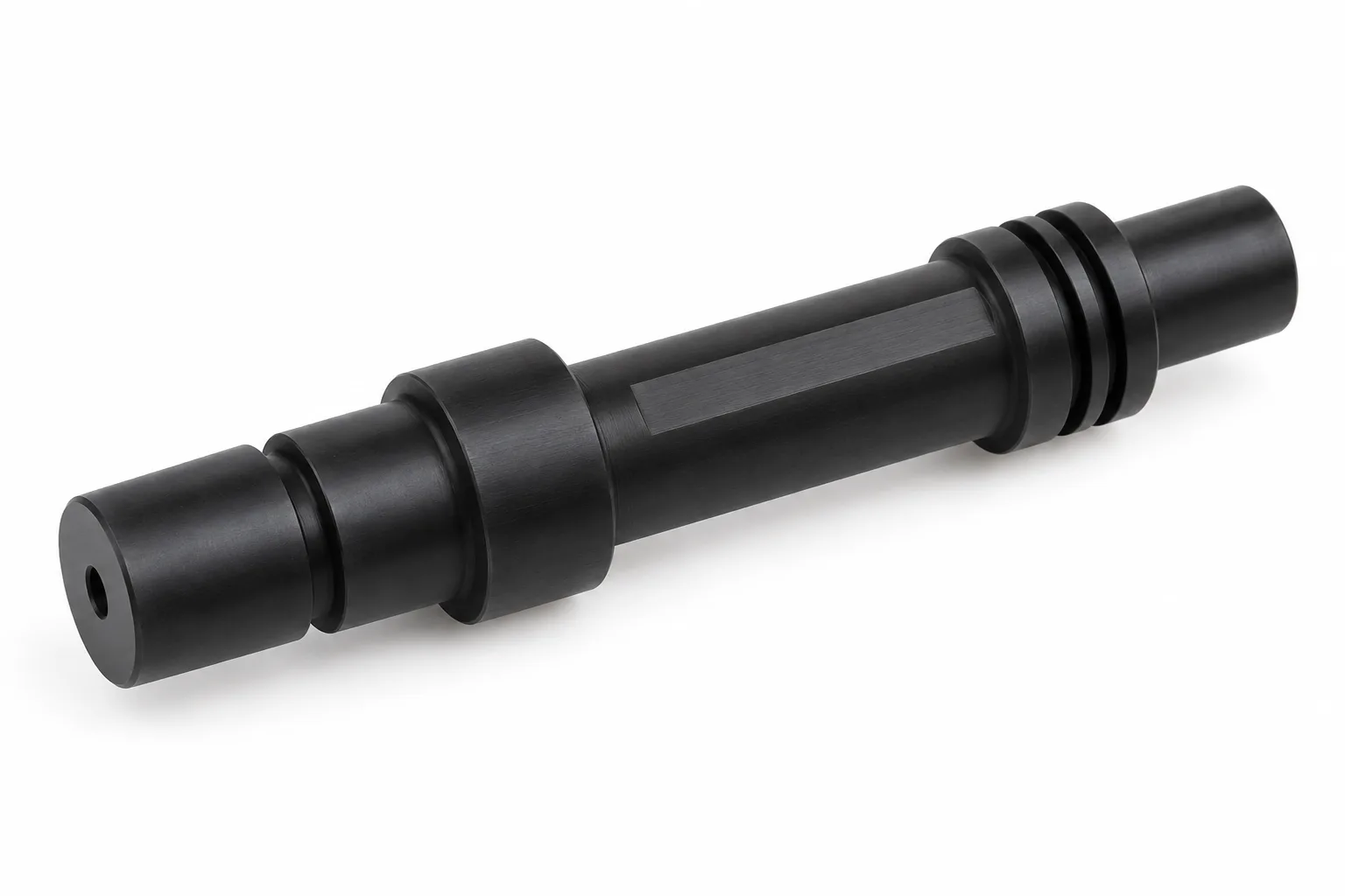 Custom Profile Shafts showing opaque acetal plastic and finished machining features on white