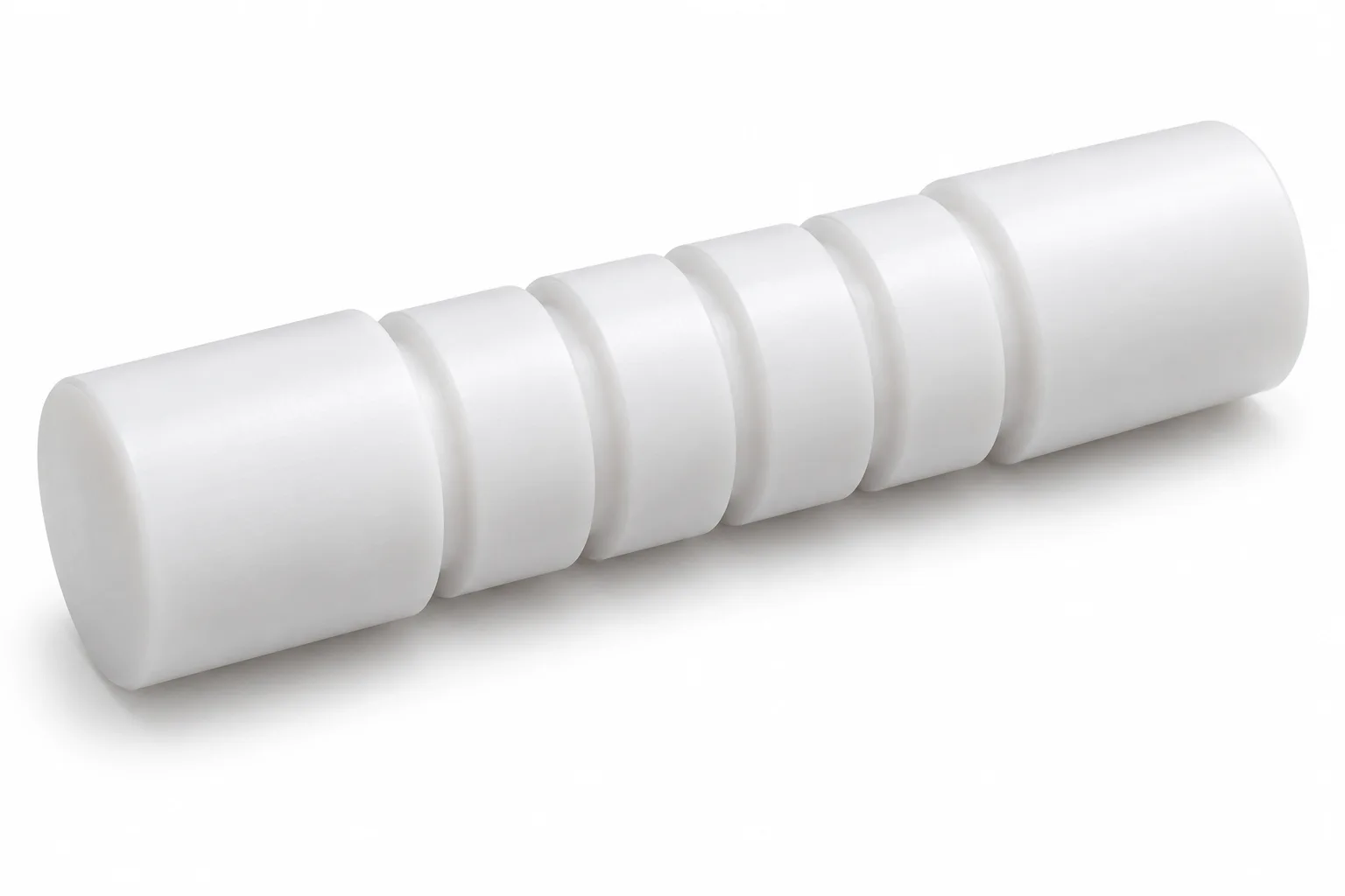Grooved PTFE Shafts with opaque white machined PTFE features on a white background