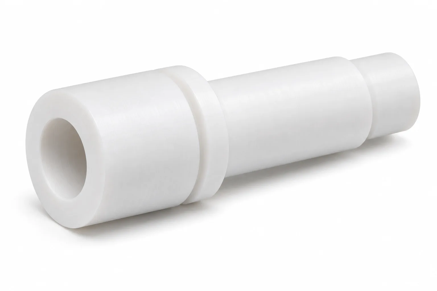 Hollow PTFE Shafts with opaque white machined PTFE features on a white background