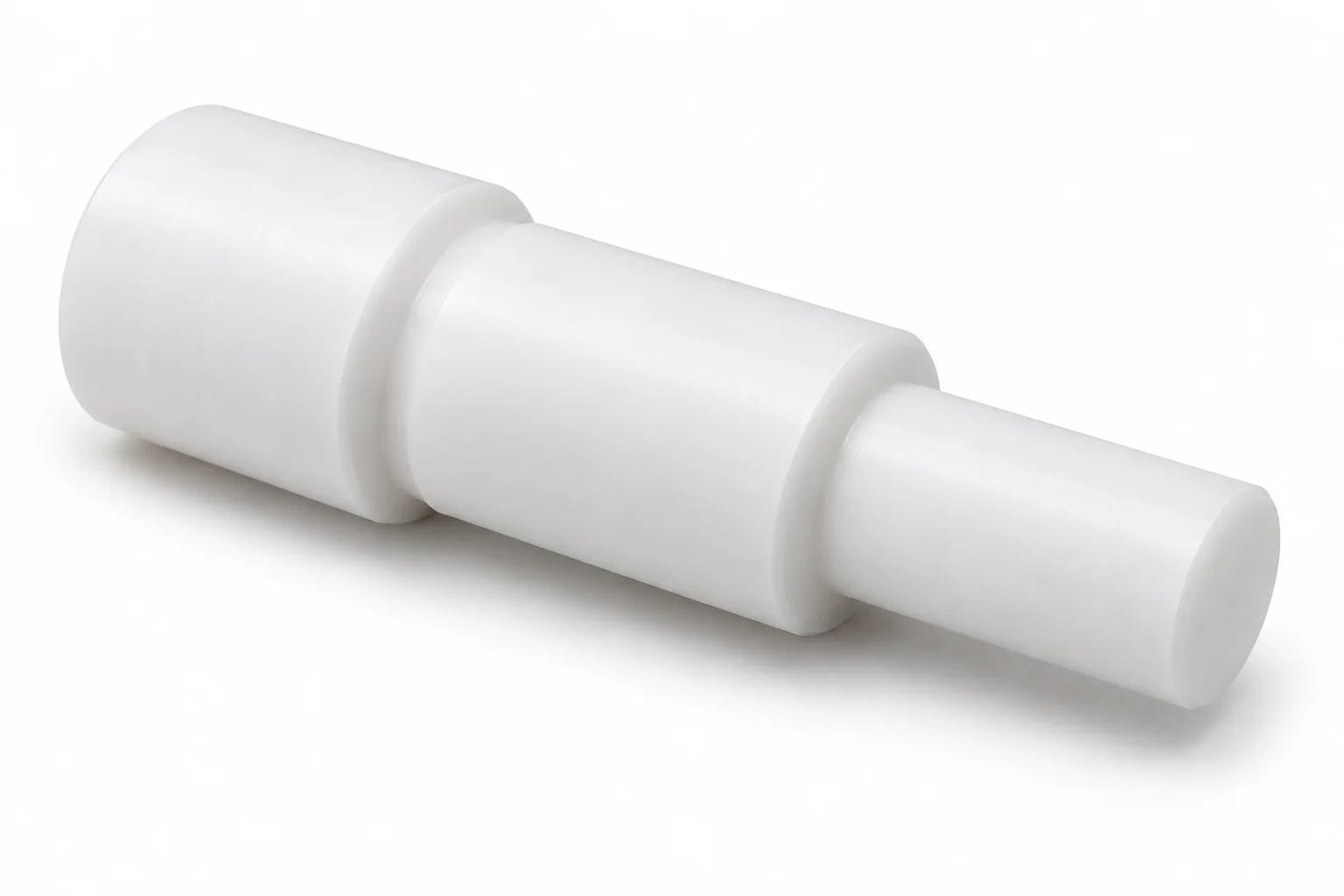 Stepped PTFE Shafts with opaque white machined PTFE features on a white background